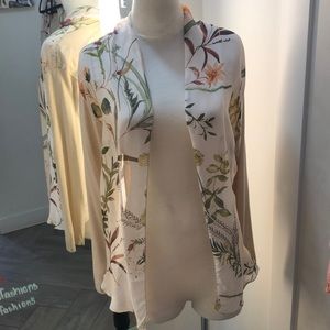 An off-white long sleeve cardigan